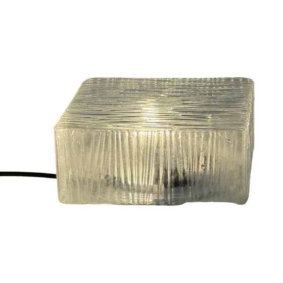 Image 1 of Art deco style lamp made from a metal base that houses an opaline dome. The dome is secured in place with a spring mechanism mak