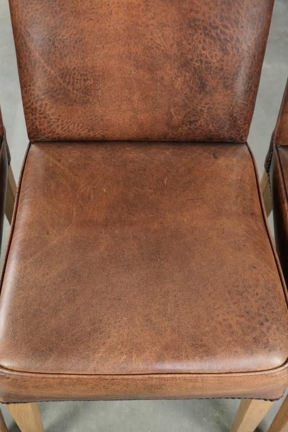 Image 1 of 4 x Vintage eetkamerstoel gemaakt van schapenleer met een hoge rug