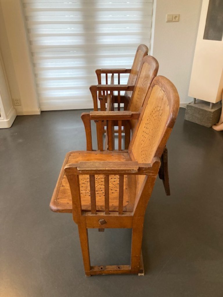 3 auction chairs with folding table on the back