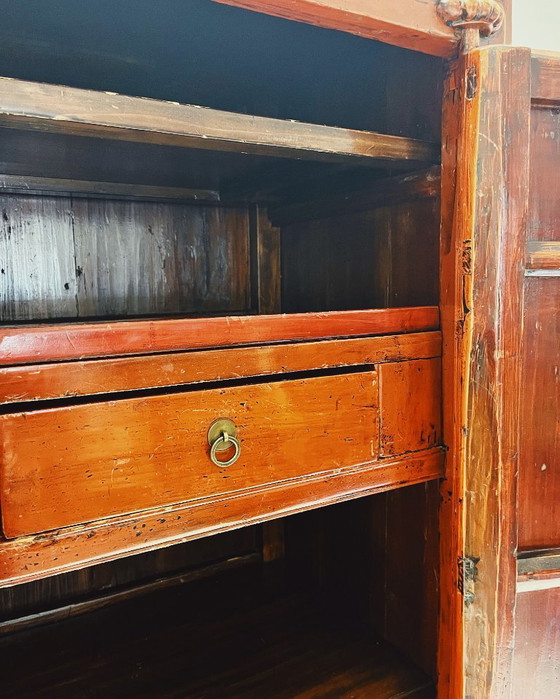 Image 1 of Antique red cabinet with brass details