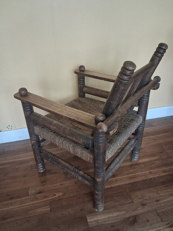 Image 1 of Dudouyt fauteuil van hout en riet.