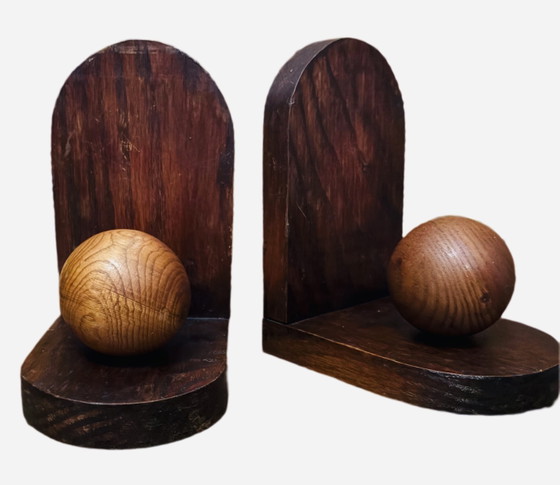 Image 1 of 2x Art Deco bookends. Left the paper in place and don't know if there is anything underneath.