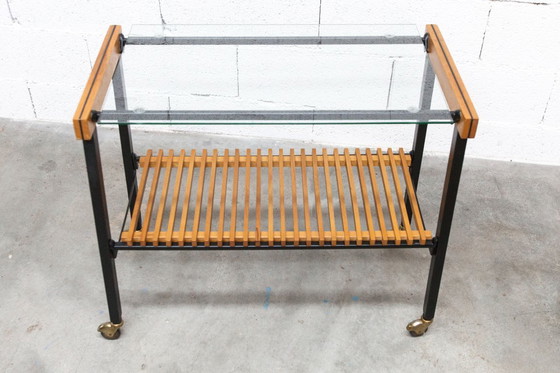 Image 1 of Serveerwagen uit de jaren 60, hifi-kast op wieltjes in teakhout, zwart metaal en glazen blad.