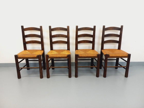 Image 1 of Set van 4 vintage brutalistische stoelen van Georges Robert, gemaakt van hout en stro, uit de jaren 50 en 60.