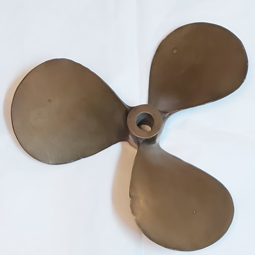 Very old bronze ship propeller in natural patina