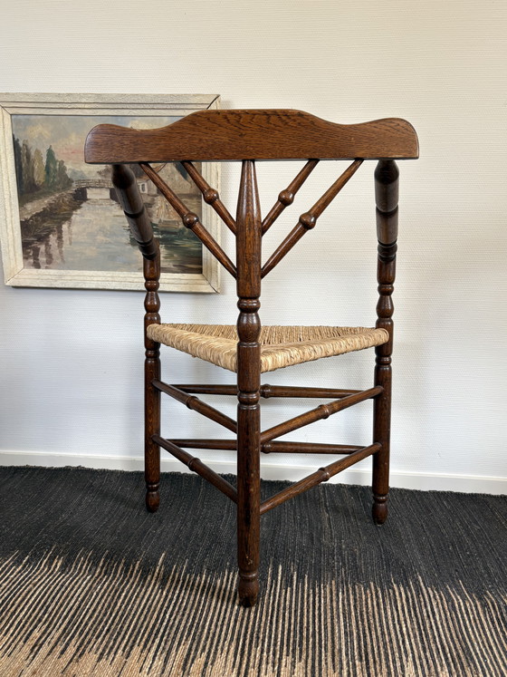 Image 1 of  Vintage Antiek 20ste eeuw eiken hoekstoel met biezen zitting h85cm