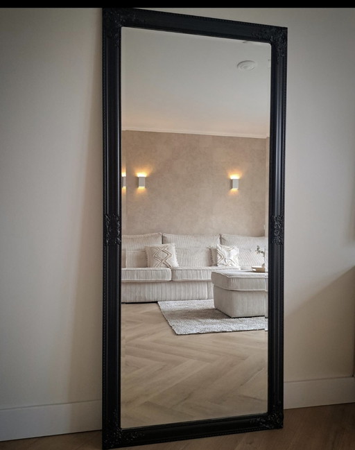 Large black hotel chic mirror with facet