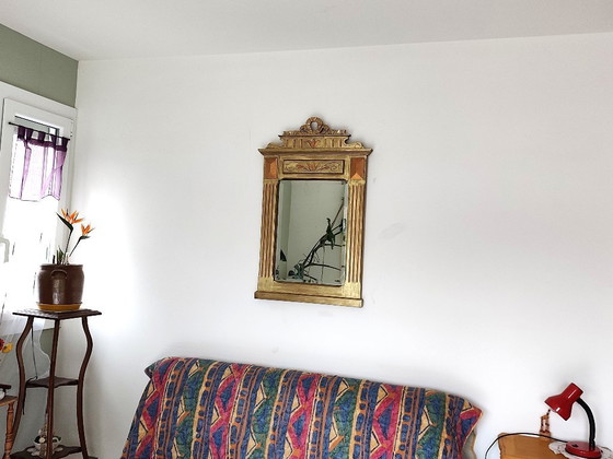 Image 1 of Gilded wooden mirror with carved pediment in the trumeau style