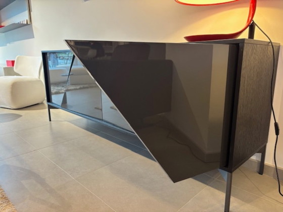 Image 1 of KENDO IS A SIDEBOARD WITH UNUSUAL GEOMETRIC DOORS: EACH ONE HAS A 30° CUT THAT DIVIDES IT INTO TWO PARTS THAT ARE NOT PERFECTLY 