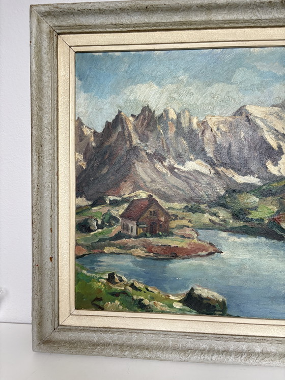 Image 1 of Vintage Alpine Lake Chateau: Gilded Masterpiece by E. Cools (1960)
