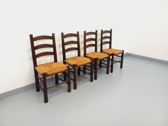Image 1 of Set van 4 vintage brutalistische stoelen van Georges Robert, gemaakt van hout en stro, uit de jaren 50 en 60.