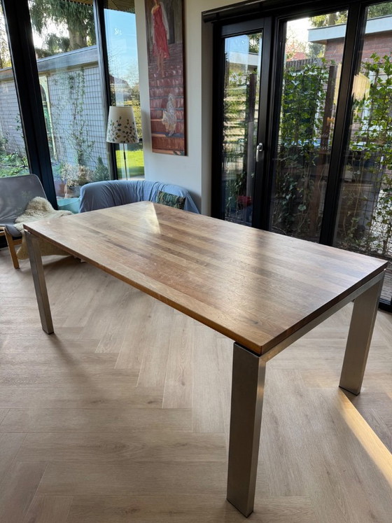 Image 1 of Walnut wood table with stainless steel legs