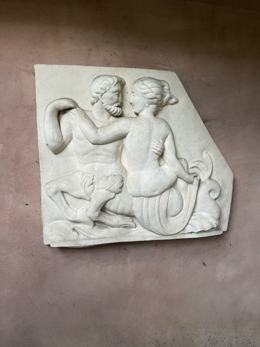 Classical relief of man and woman in stone