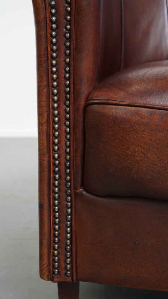 Image 1 of Sheep Leather Club Chair in a Dark Cognac Color