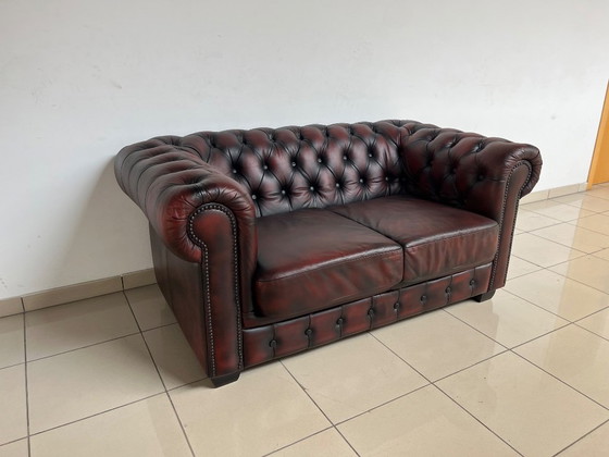 Image 1 of Chesterfield Sofa in Oxblood Leather – Fully Restored, Classic Design