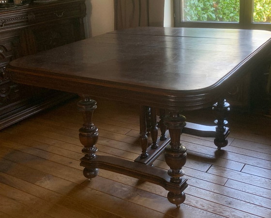 Image 1 of Antique, oak extendable table and 8 matching chairs on casters