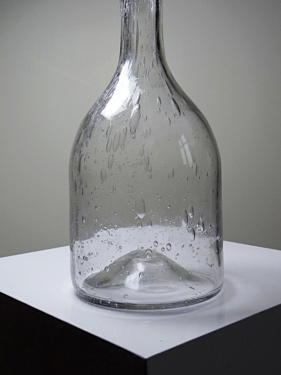 Image 1 of Large antique bottle in blown glass with bubbles, early 20th century, 1900-1920