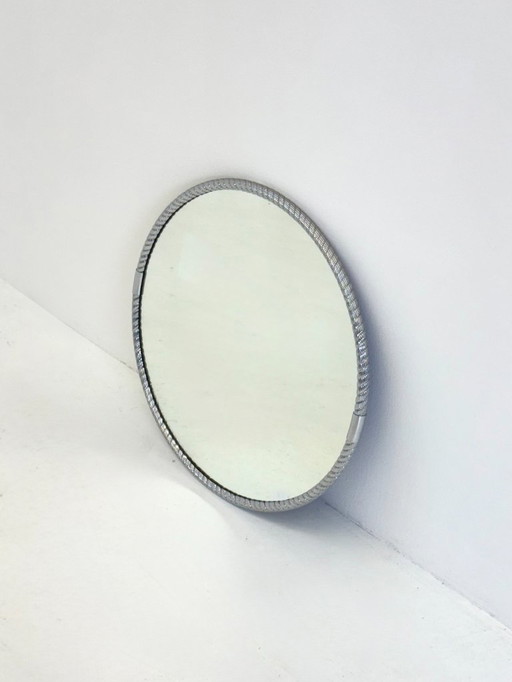 Round vintage mirror with tubular frame