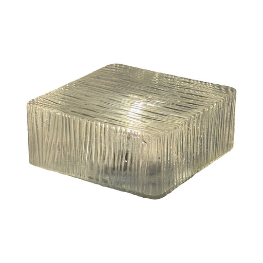 Art deco style lamp made from a metal base that houses an opaline dome. The dome is secured in place with a spring mechanism mak