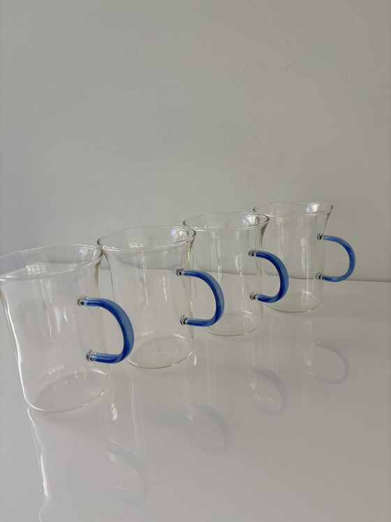 Image 1 of Set of four glass tea mugs with colored handles