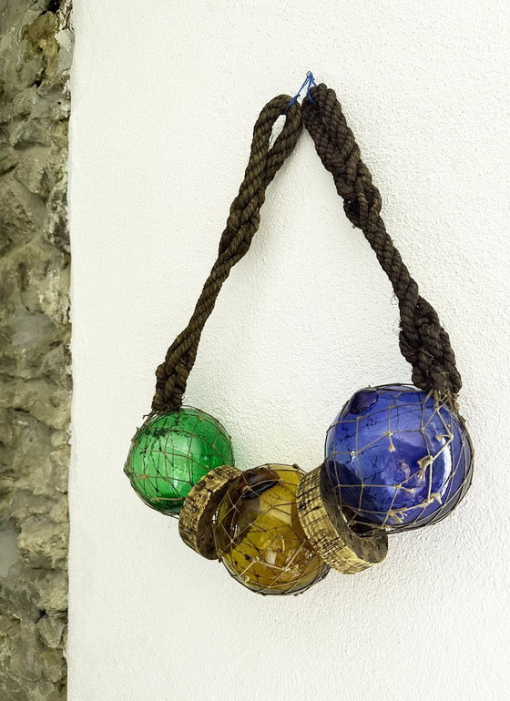 Image 1 of Fishing float made of blown glass, cork, and rope. France, 1960s