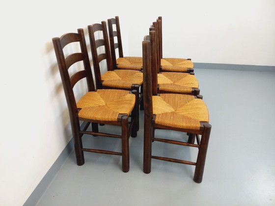 Image 1 of Set van 6 vintage brutalistische stoelen van Georges Robert, gemaakt van hout en stro, uit de jaren 50 en 60.