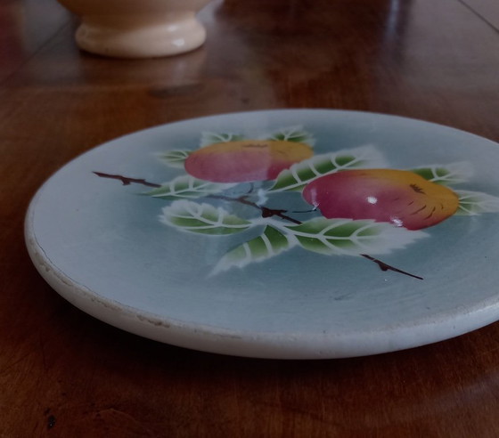 Image 1 of Salvamanteles pequeño y redondo de loza