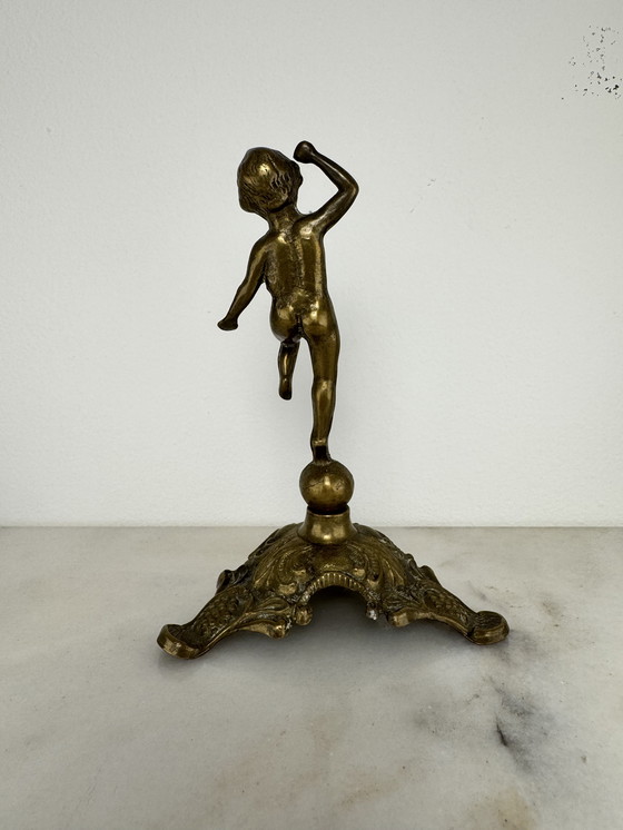 Image 1 of Antique bronze figurine of playing child - decorative and rare