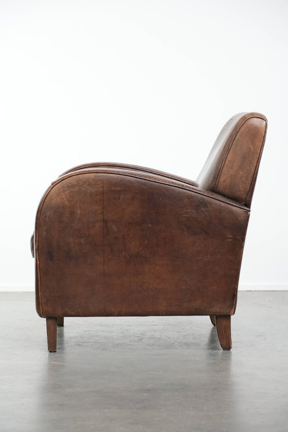 Image 1 of Vintage schapenleren armchair met een ronde vormgeving 