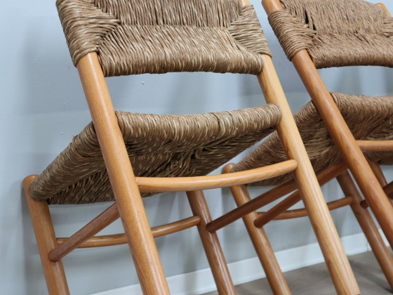 Image 1 of Juego de 8 sillas estilo Charlotte Perriand de los años 60, de paja tejida y madera.