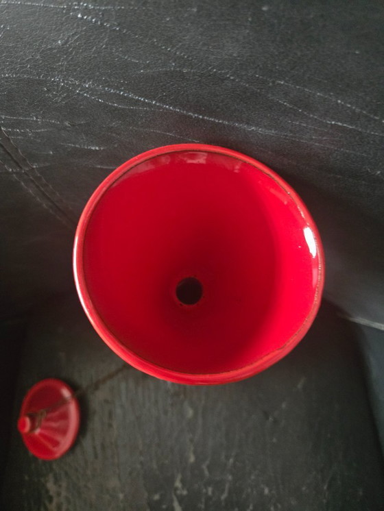 Image 1 of Red "snotje" or small oil lamp, made by Neerlandia. Height: 30 cm.