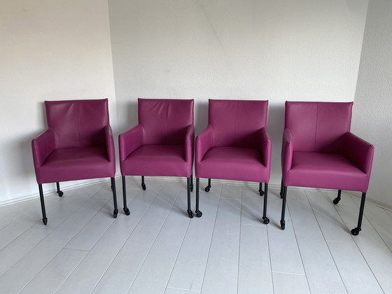 Image 1 of Luxurious fuchsia leather dining chairs with wheels