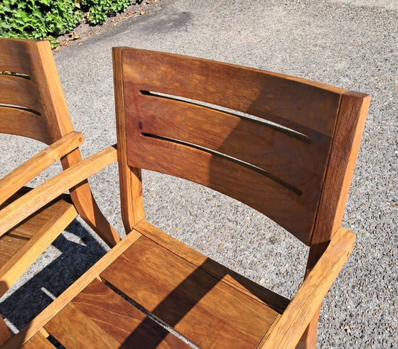 Image 1 of 6 Traditional Teak stacking chairs with armrests