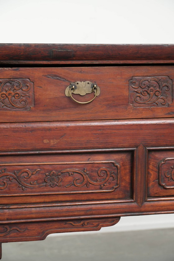 Image 1 of Antique wooden Chinese sideboard from the late 19th century in a beautiful red color with exquisite wood carving.
