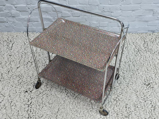 Image 1 of Vintage Foldable and Mobile Chrome Steel 2 Floral Decorated Layers ‘Dinett’ Serving Trolley by Gerlinol, Germany, 1970s. 