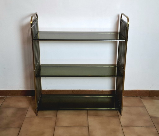 Italian shelf in chromed metal, brass and glass. 1970s.