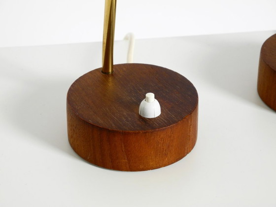 Image 1 of A pair of beautiful mid-century modern bedside lamps with perforated metal shades and teak wood bases