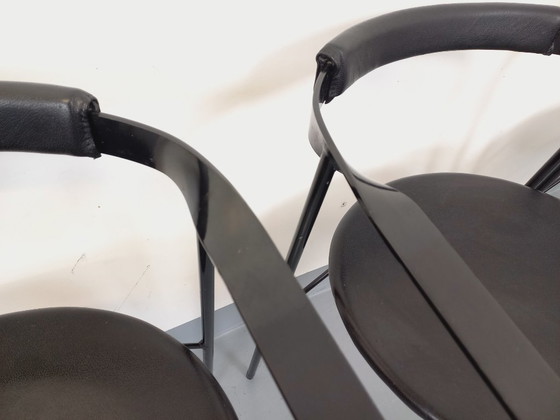 Image 1 of Set di 4 poltrone vintage di design italiano in metallo nero e similpelle nera degli anni '80