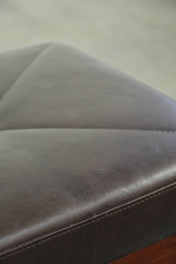 Image 1 of Luxe Schuitema Art Deco design set bestaande uit een fauteuil en hocker uit de Decoforma serie in chocolade bruin rundleer