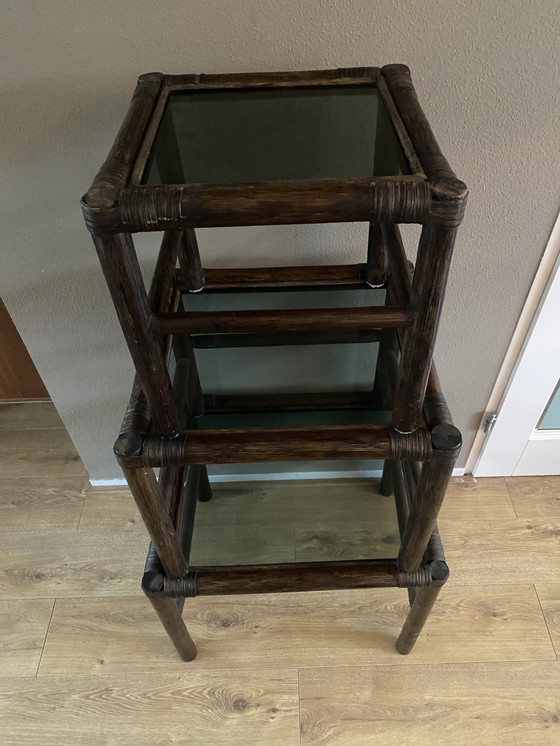 Image 1 of Vintage rattan bamboo nesting tables mimeset smoked glass