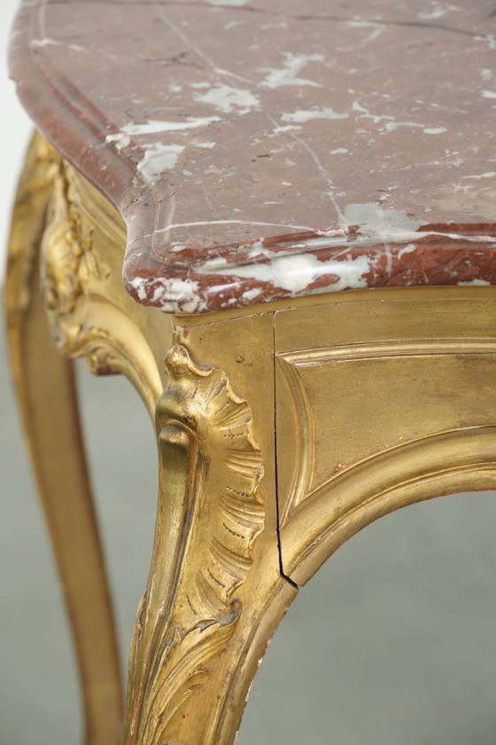 Image 1 of Antique French side table/center table from the 19th century with a gold-colored wooden frame and an original marble tabletop.
