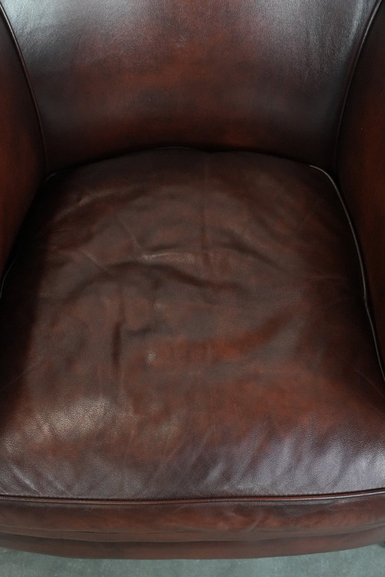 Image 1 of 2 poltrone club in pelle bovina in buone condizioni, di un lussuoso colore rosso/marrone.