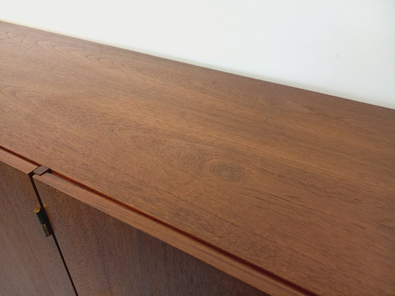 Image 1 of Tall, modernist, vintage Scandinavian sideboard in teak and black metal from the 1960s