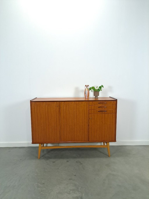 Teak cabinet with sloping legs and drawers from Sweden