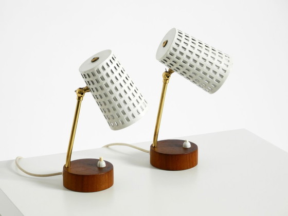 Image 1 of A pair of beautiful mid-century modern bedside lamps with perforated metal shades and teak wood bases