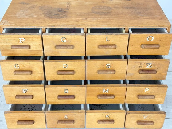 Image 1 of Beautiful vintage apothecary cabinet / compartment cabinet on casters – 16 compartments