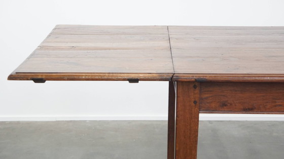 Image 1 of Table de salle à manger ancienne en chêne du début des années 1900 avec plateau rabattable d'un côté