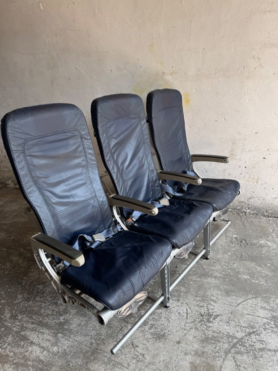 Image 1 of Vintage driepersoons vliegtuigstoelen - Recaro