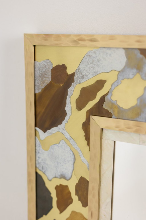 Mirror in marquetry of oxidized and patinated brass. Artist's work