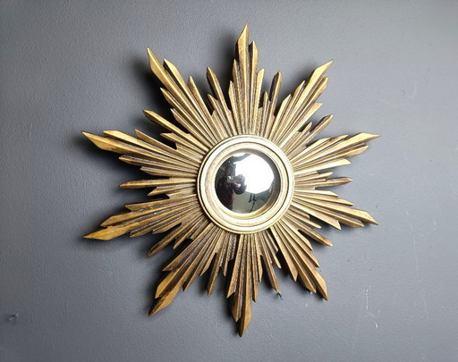 Beautiful resin sunburst mirror with convex mirror glass.  The golden mirror is in a good condition.  1960s - made in Belgium.  